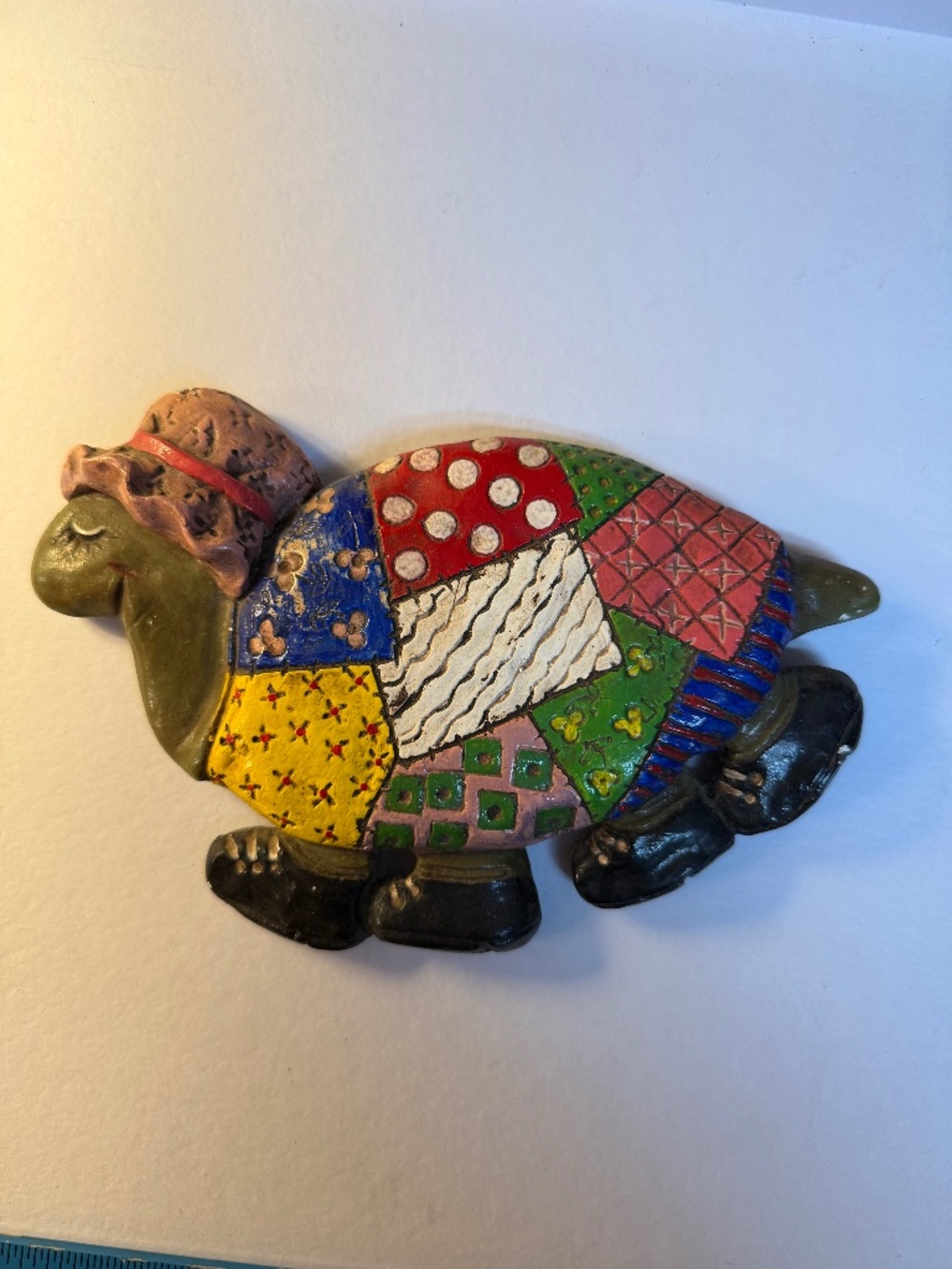 colorful, patchwork-painted resin turtle figurine with whimsical folk art detail